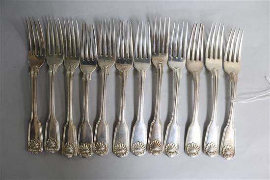 A harlequin set of twelve William IV silver fiddle, thread and shell dessert forks. 22.5 oz.